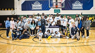 The National Park College men's basketball team, along with staff and friends, pose for a photo following the Nighthawks' NJCAA Division II National Championship victory in Danville, Ill., on March 25. (Submitted photo)